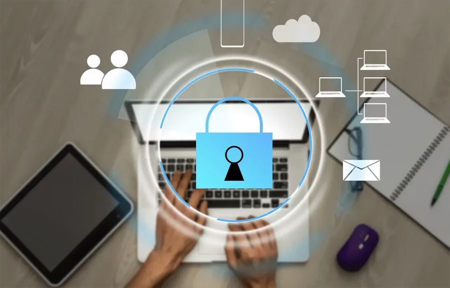 hands placed over a laptop with security symbol graphics overlaid